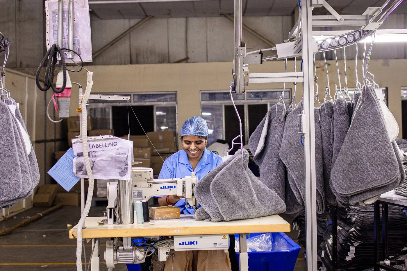 Operator sewing on the production line
