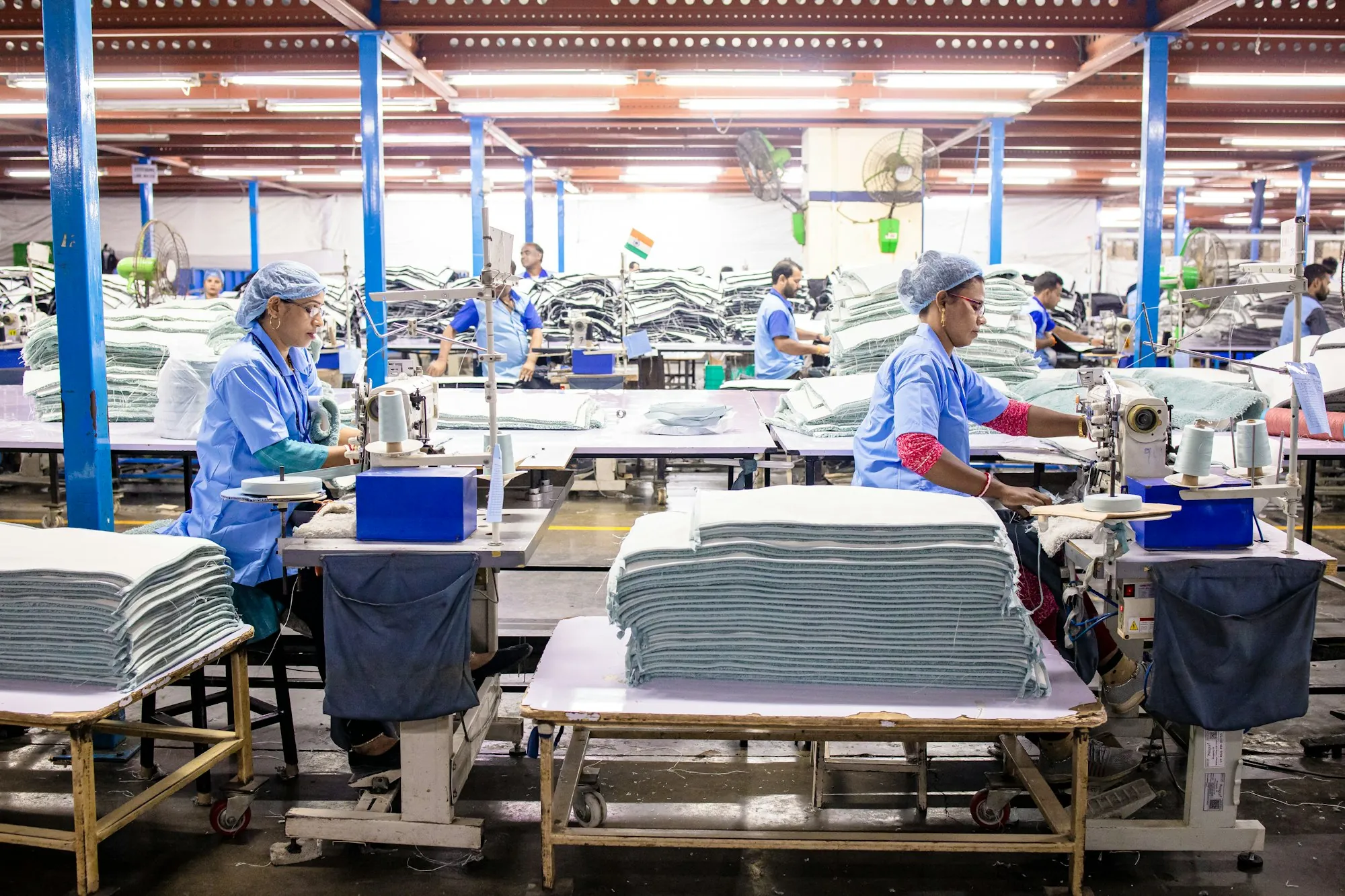 Garment factory sewing floor with operators at work