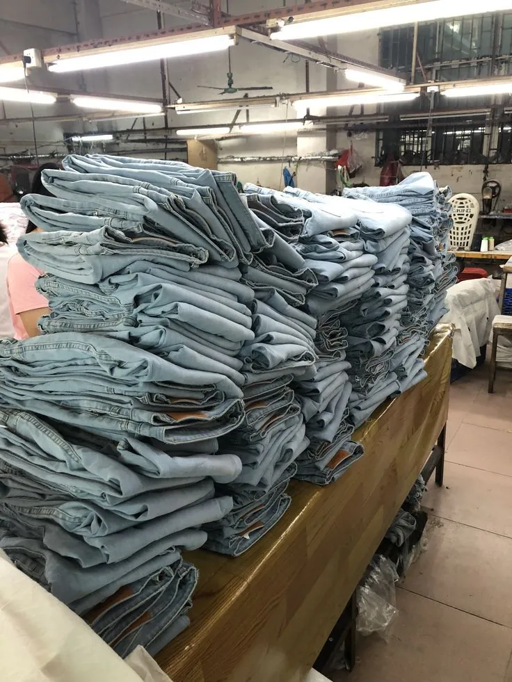 Stacked folded jeans on the production floor
