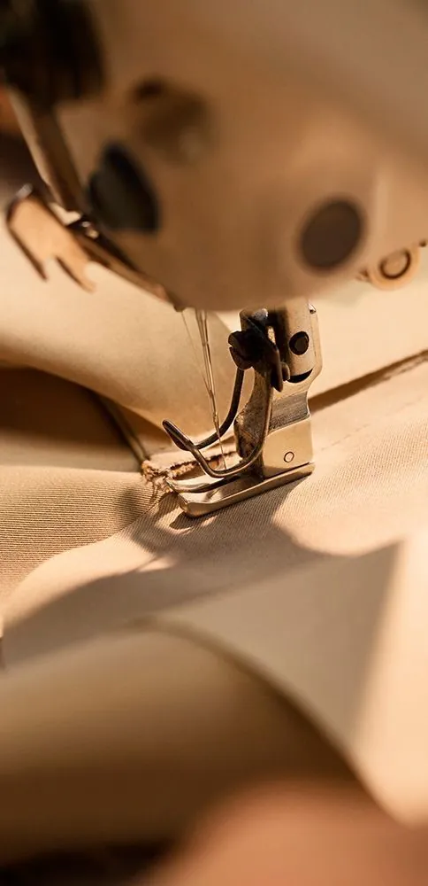 Sewing machine stitching a garment seam